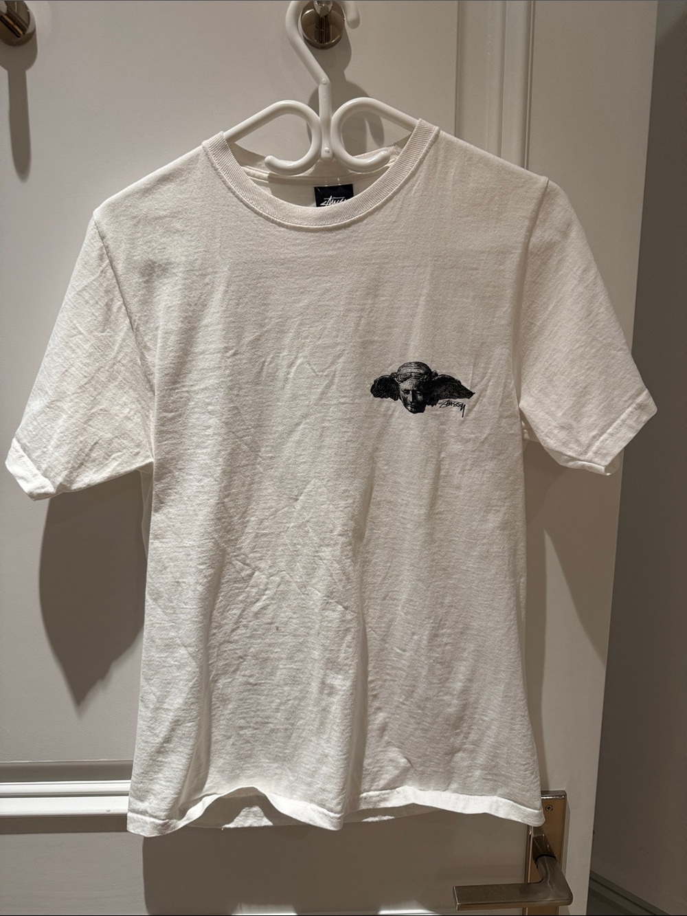 Stussy White Short Sleeve Tee with Small Black Graphic